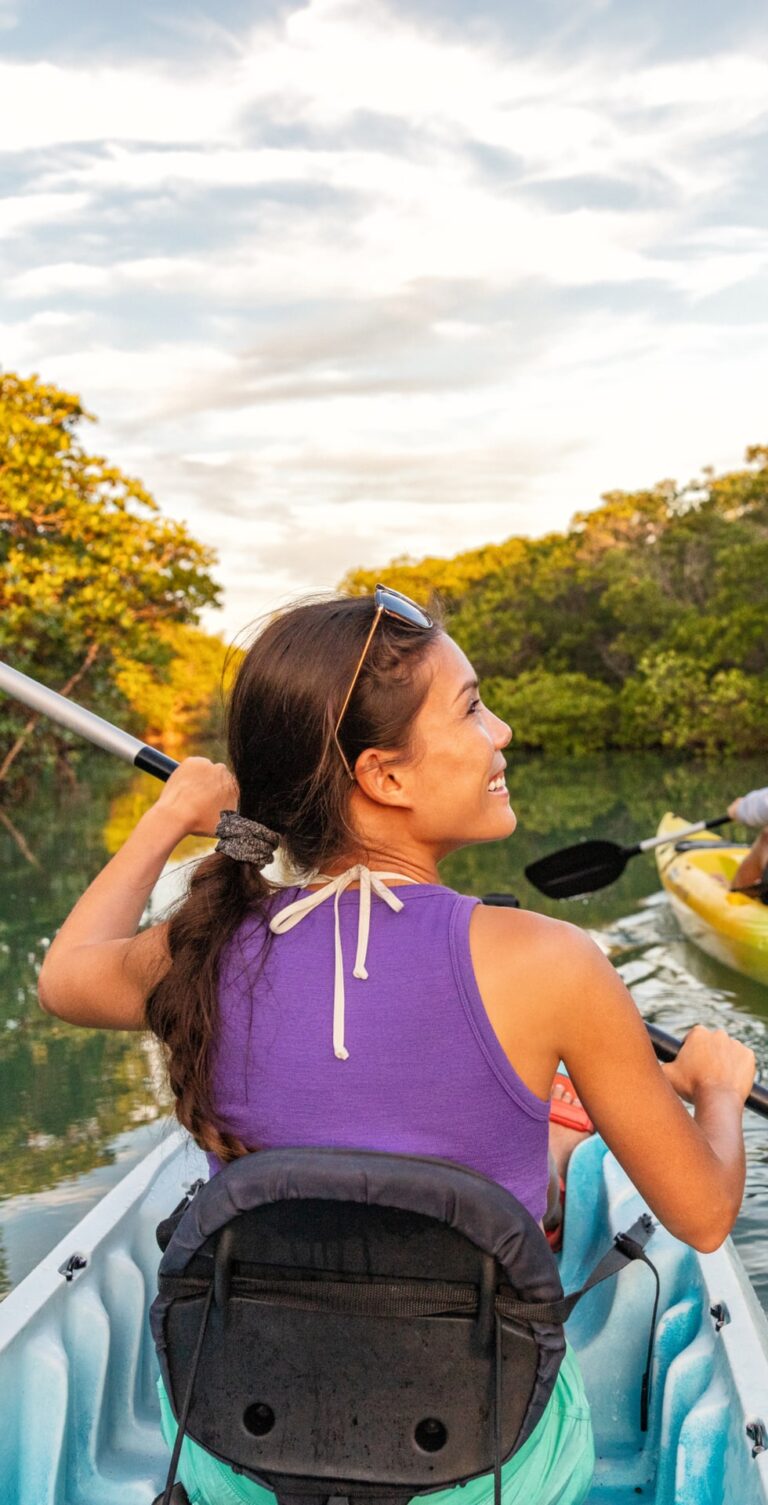 Couple kayaking together in mangrove river of the Keys, Florida, USA